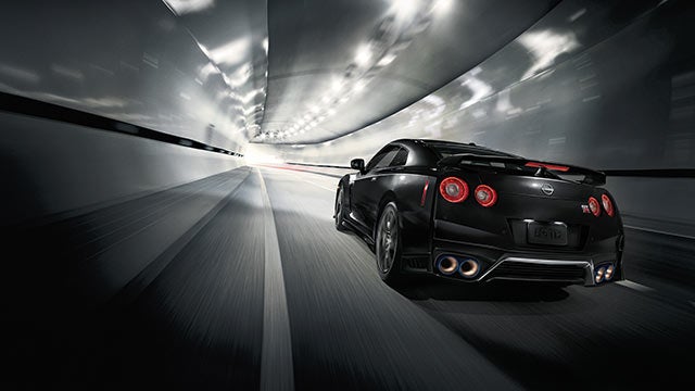 2023 Nissan GT-R seen from behind driving through a tunnel | Granite Nissan in Rapid City SD